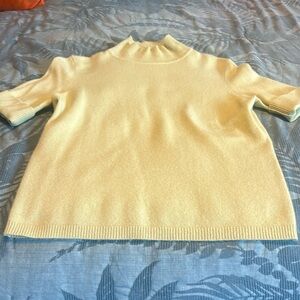 Beautiful celery, green colored hundred percent cashmere short sleeve sweater.
